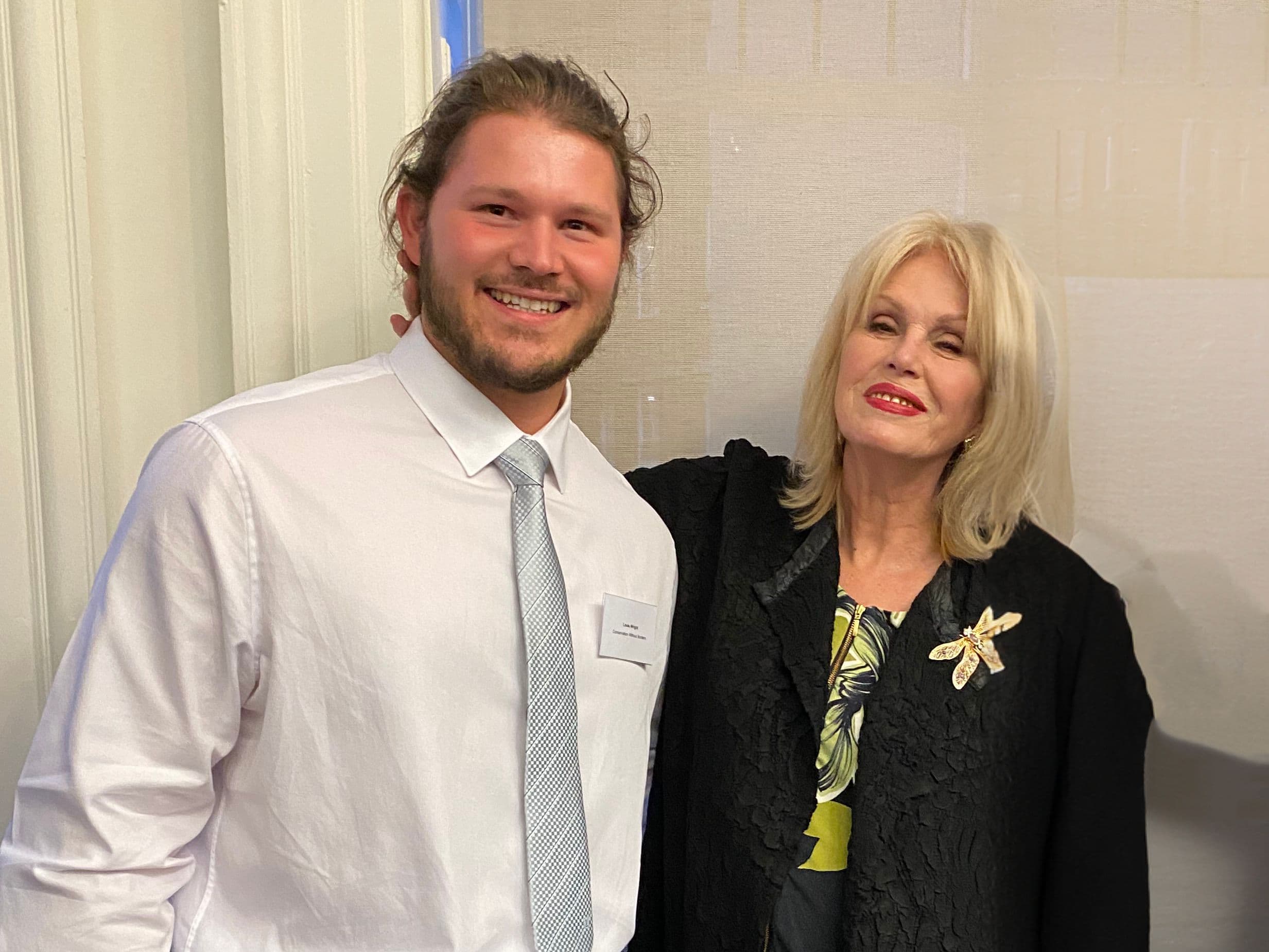 Louis Wright and Joanna Lumley together at an indoor event, professional portrait.